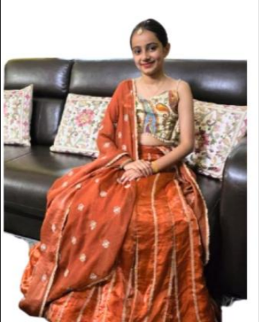 close up of hand stitched embroidery detail on a child's garment